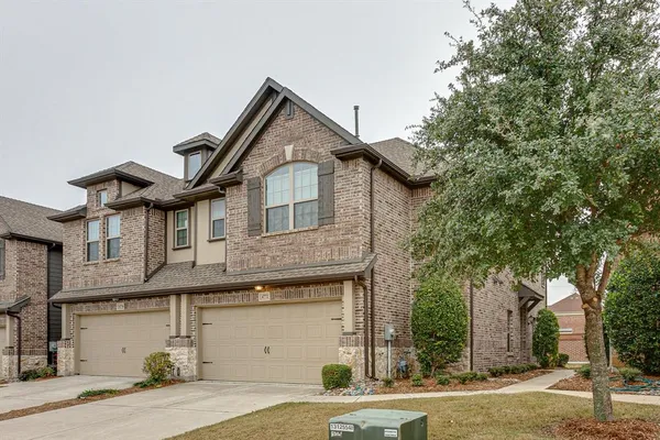 a front view of a house with garage