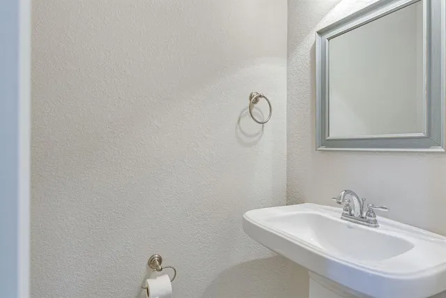 a view of a chandelier fan and wooden floor