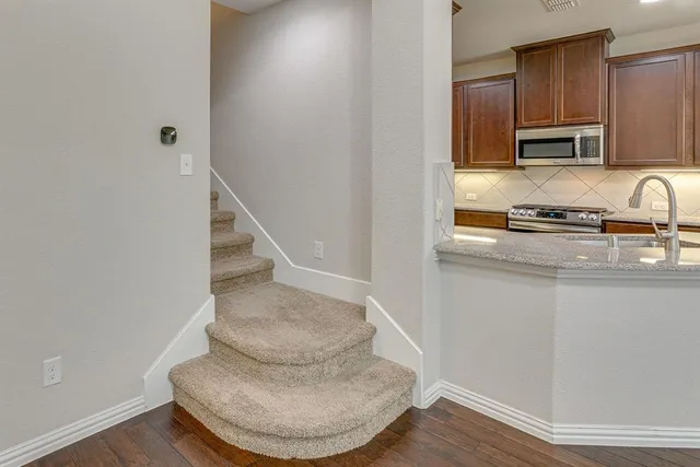 a bathroom with a sink a toilet a shower and a mirror