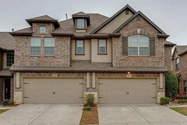 front view of a house with a street