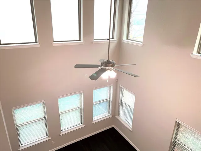 a view of an entryway with wooden floor and windows