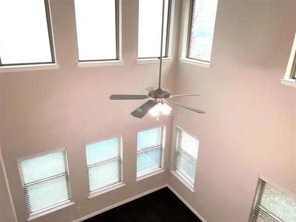 a view of an entryway with wooden floor and windows