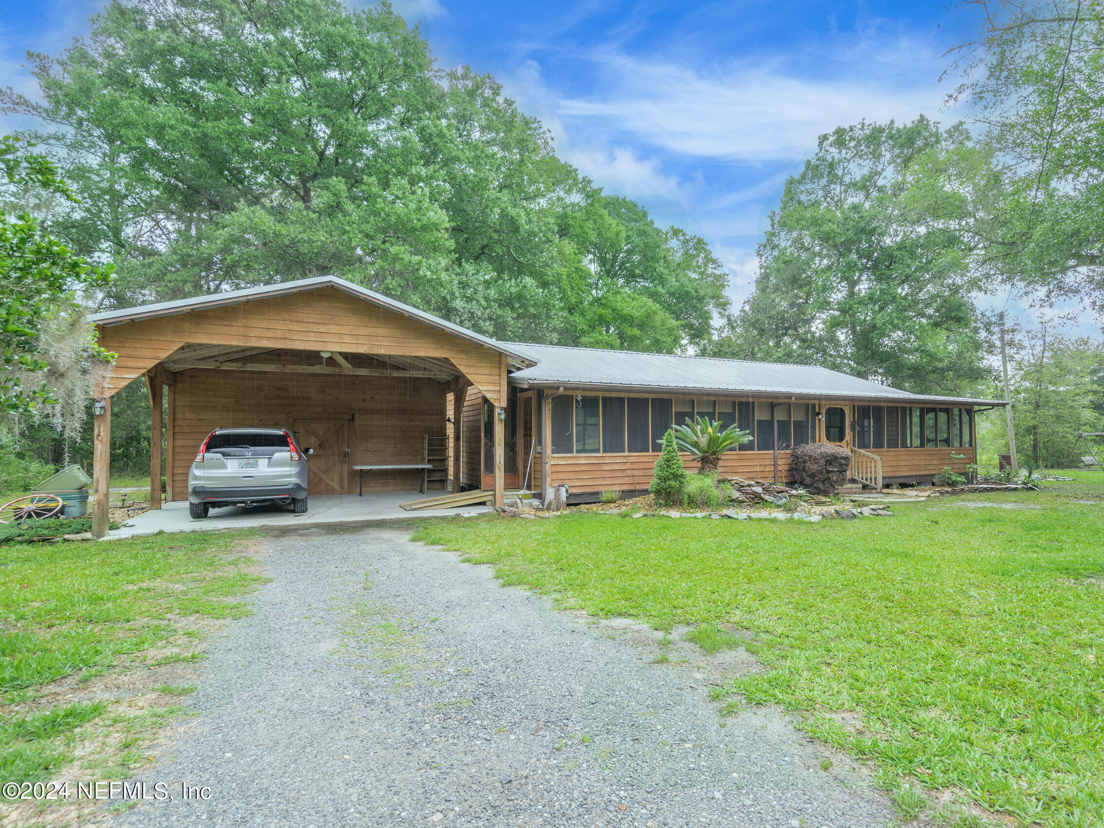 a front view of a house with a garden and porch