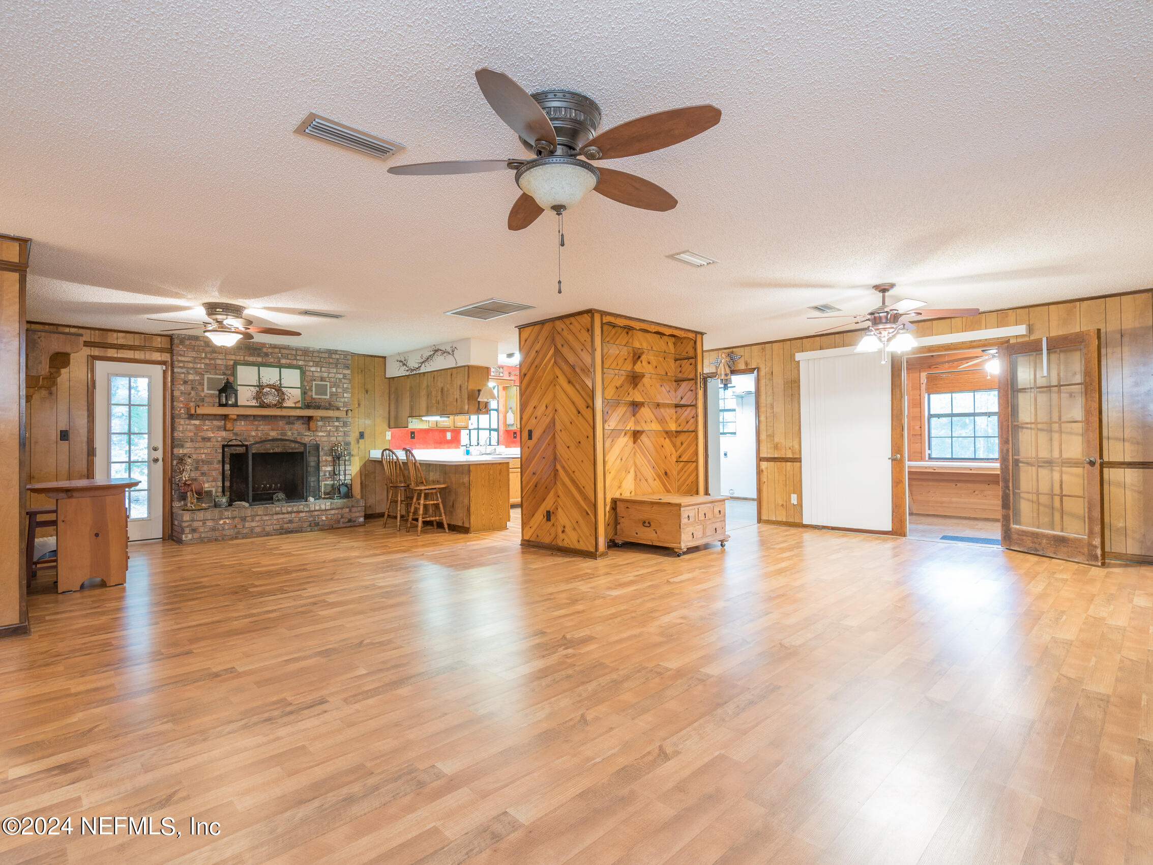 27278 Inspiration Way Hilliard, FL 32046 - Photo 11 of 25 a view of a livingroom with furniture ceiling fan and window