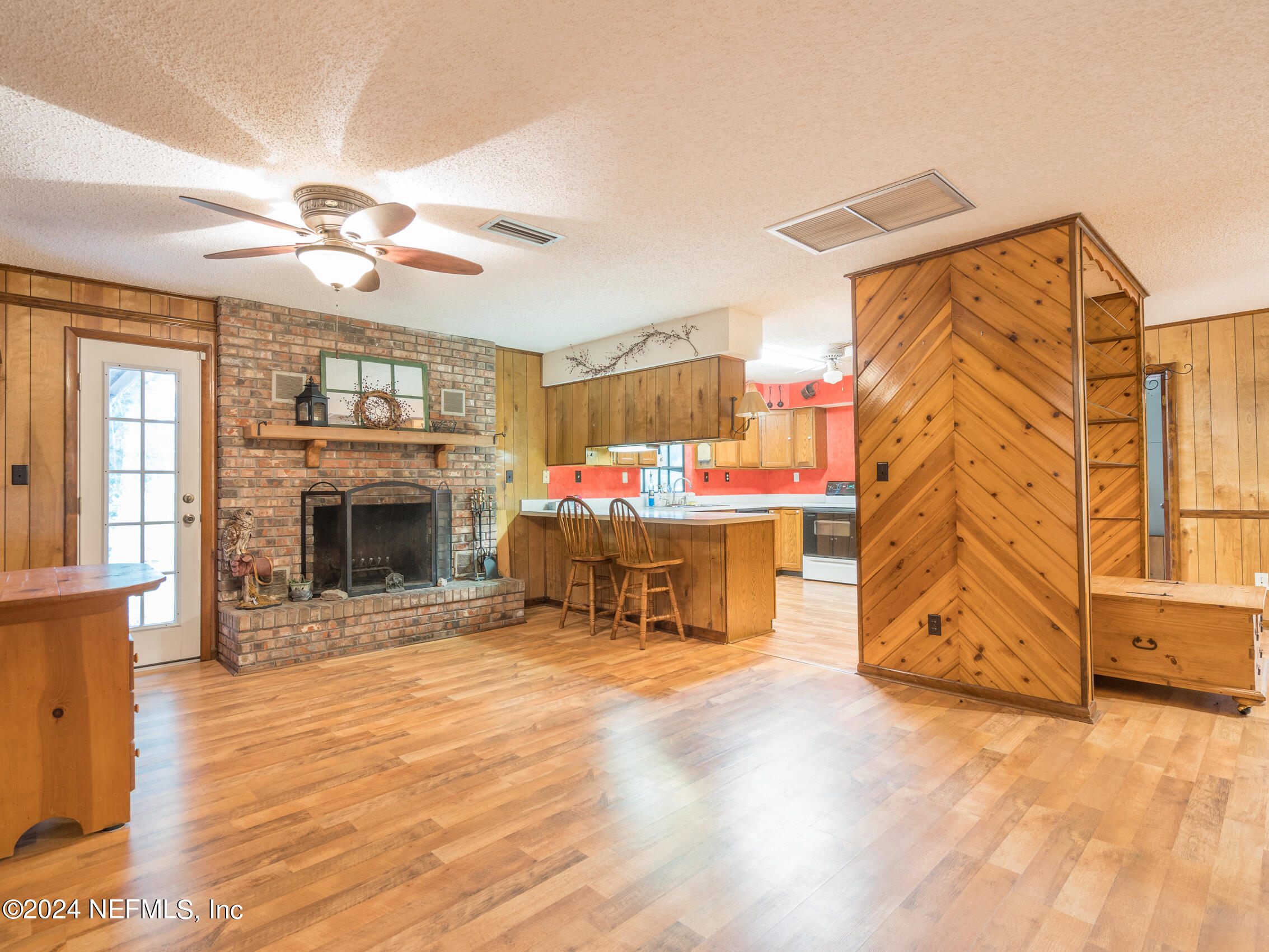 27278 Inspiration Way Hilliard, FL 32046 - Photo 14 of 25 a living room with furniture and a fireplace