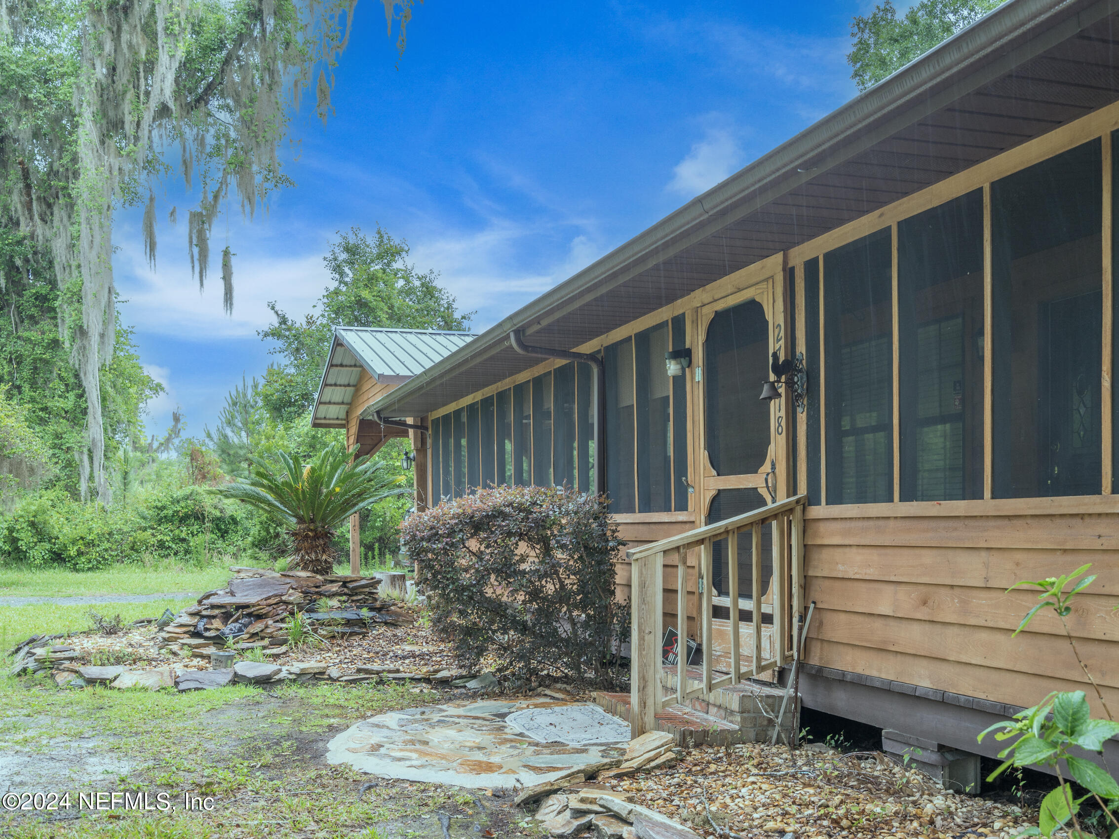 27278 Inspiration Way Hilliard, FL 32046 - Photo 2 of 25 a house with a tree in the background