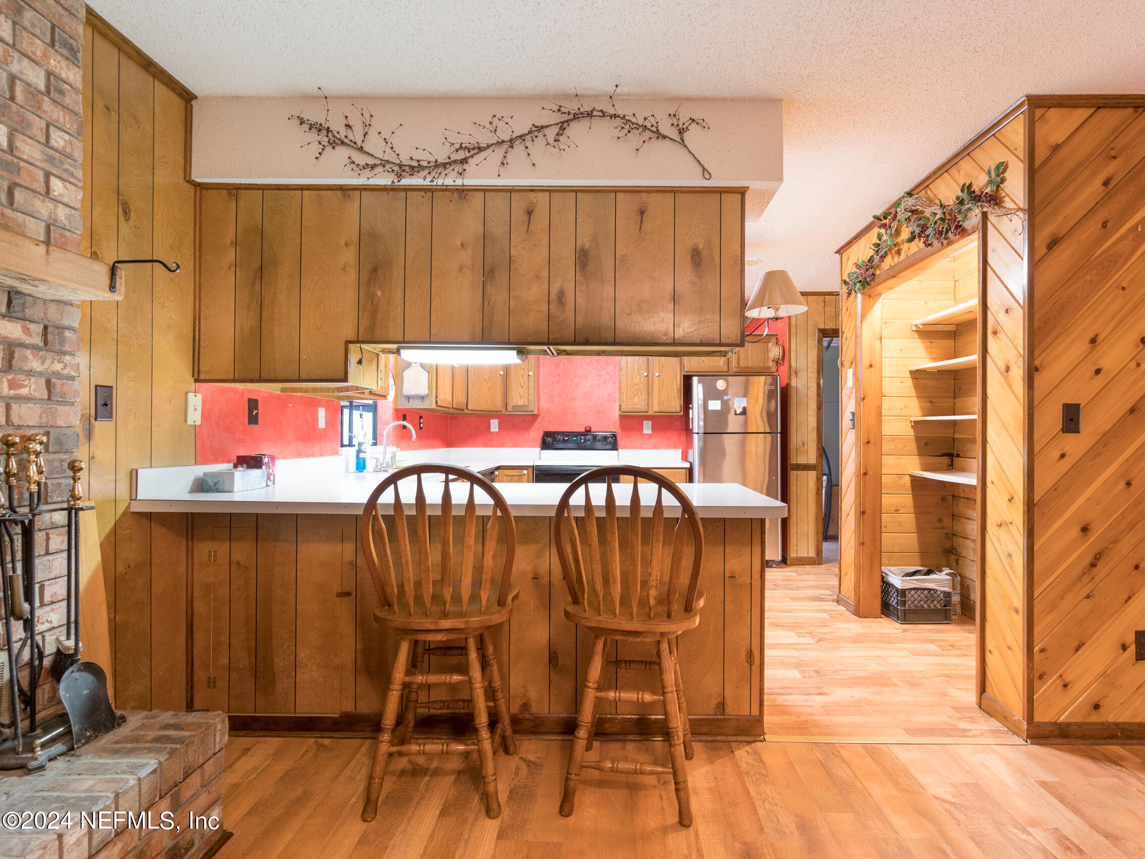 27278 Inspiration Way Hilliard, FL 32046 - Photo 24 of 25 a dining room with furniture and wooden floor