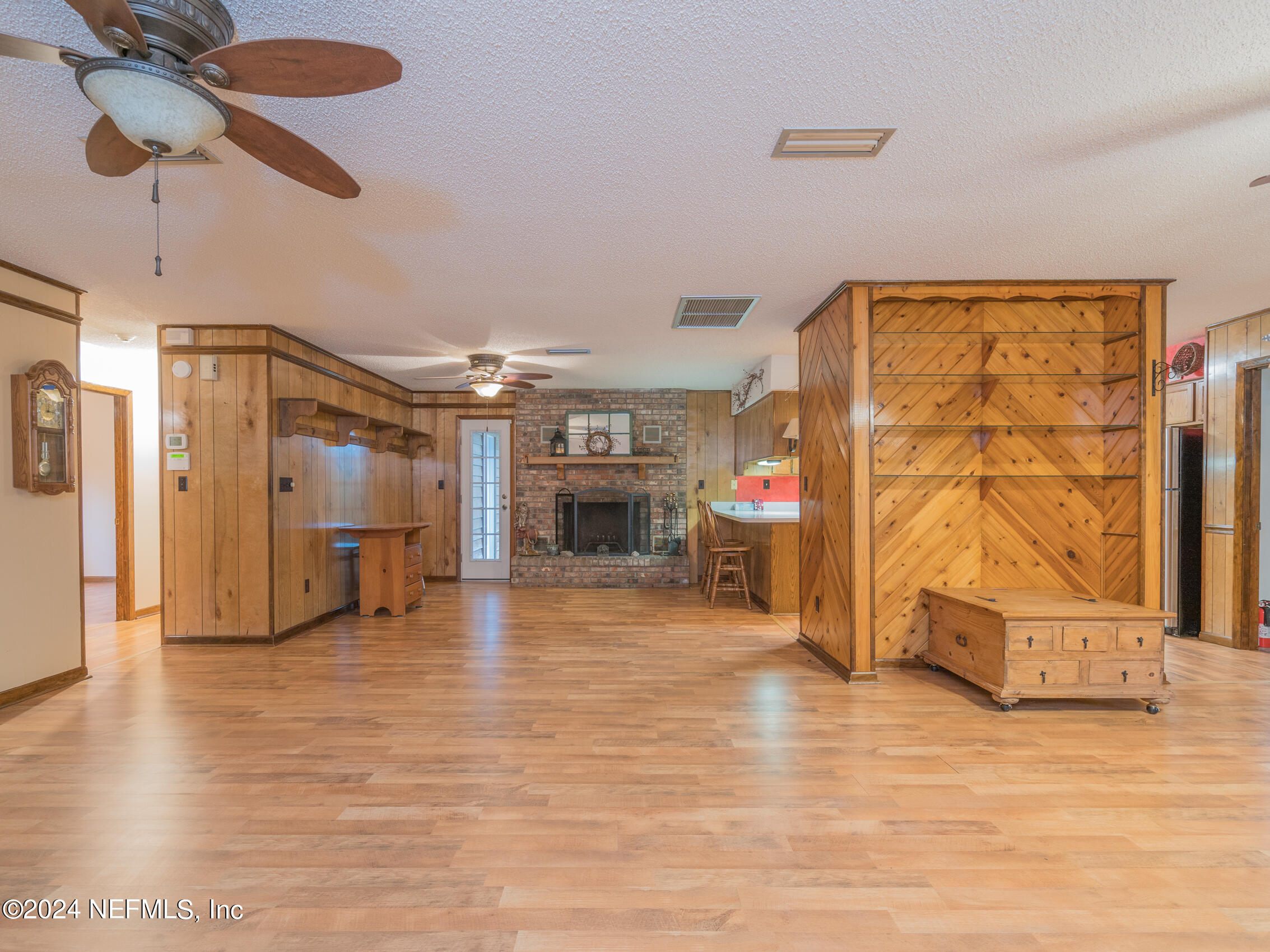 27278 Inspiration Way Hilliard, FL 32046 - Photo 25 of 25 a view of a livingroom with wooden floor a ceiling fan and windows