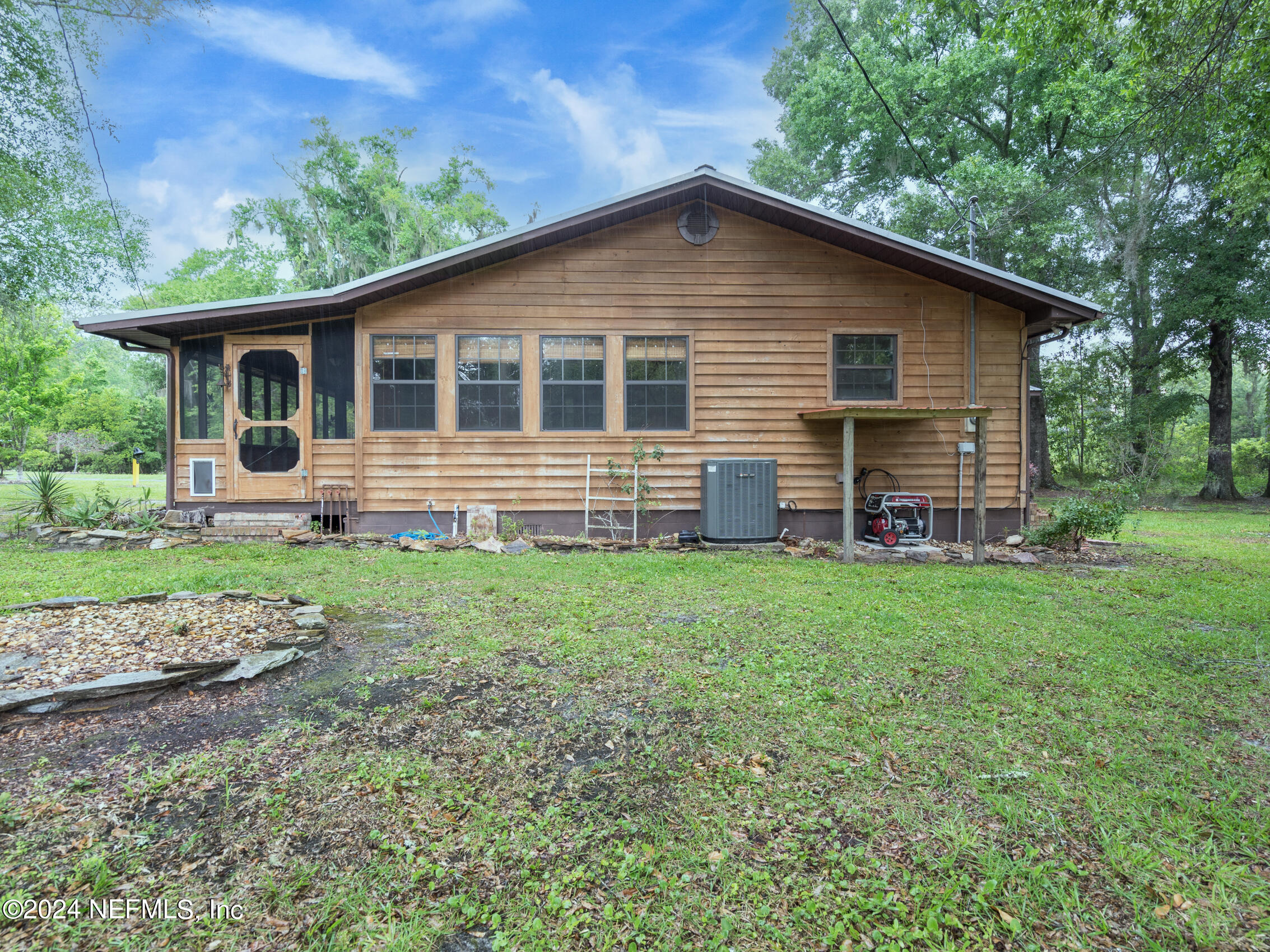 27278 Inspiration Way Hilliard, FL 32046 - Photo 7 of 25 a front view of house with yard and green space