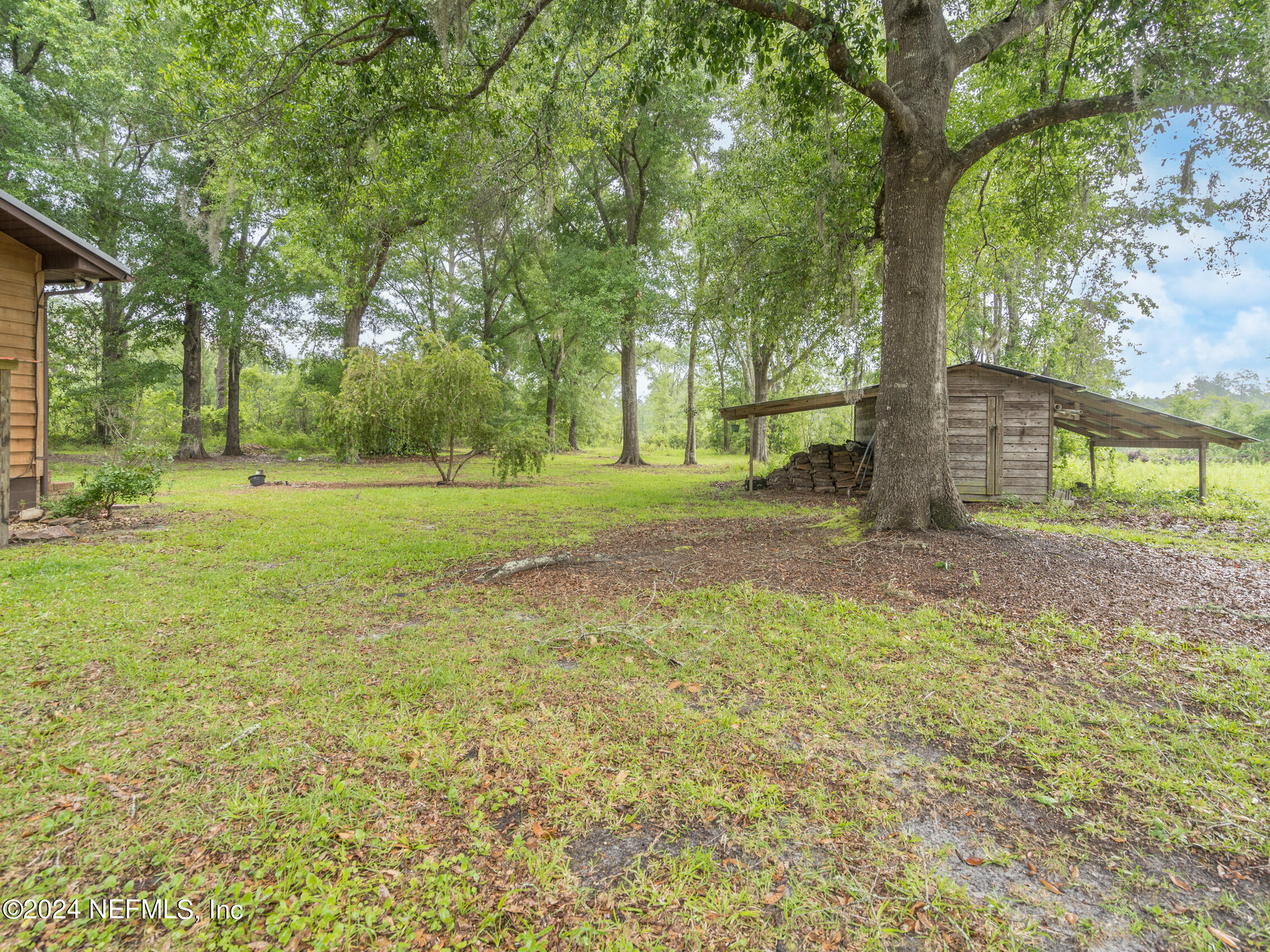 27278 Inspiration Way Hilliard, FL 32046 - Photo 8 of 25 a view of a yard with a tree