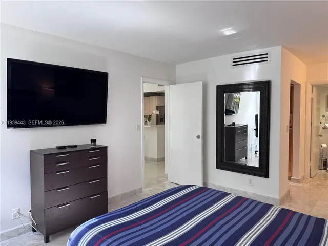 a room with a television and a bed