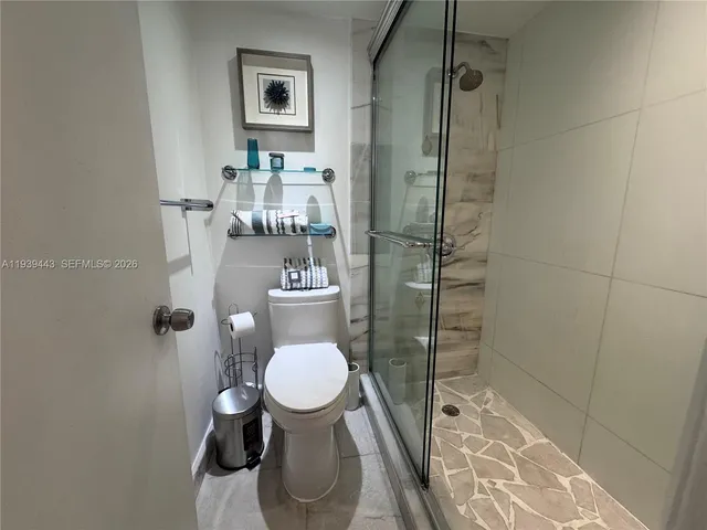 a living room with furniture and a mirror