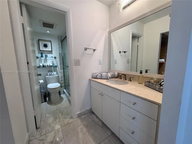 a view of a balcony with wooden floor