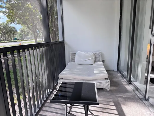 a view of outdoor space with swimming pool and brick buildings