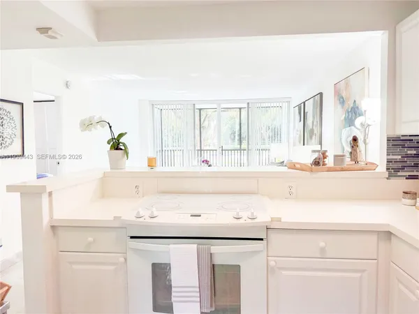 a bathroom with a sink and a window