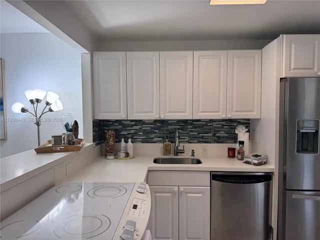 a kitchen with a sink and a window