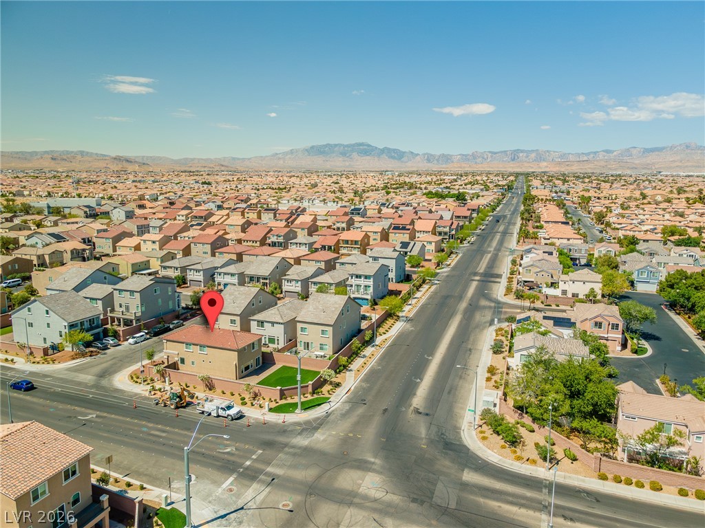 5510 Ripple Ridge Avenue Las Vegas, NV 89139 - Photo 11 of 45 An aerial perspective showcases a vibrant community with picturesque mountain views and well-maintained streetscapes.
