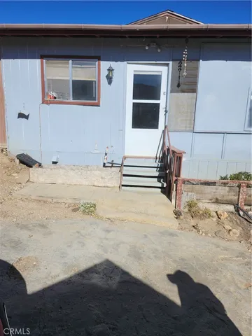 a view of a backyard of a house