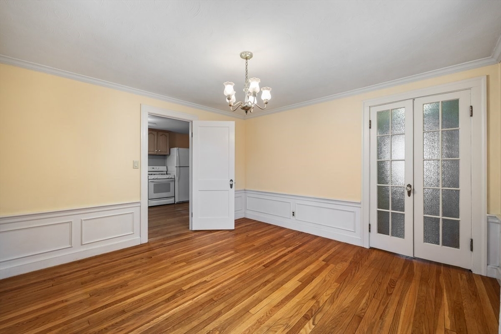 18 Bates Road Arlington, MA 02474 - Photo 11 of 42 wooden floor in an empty room with a window