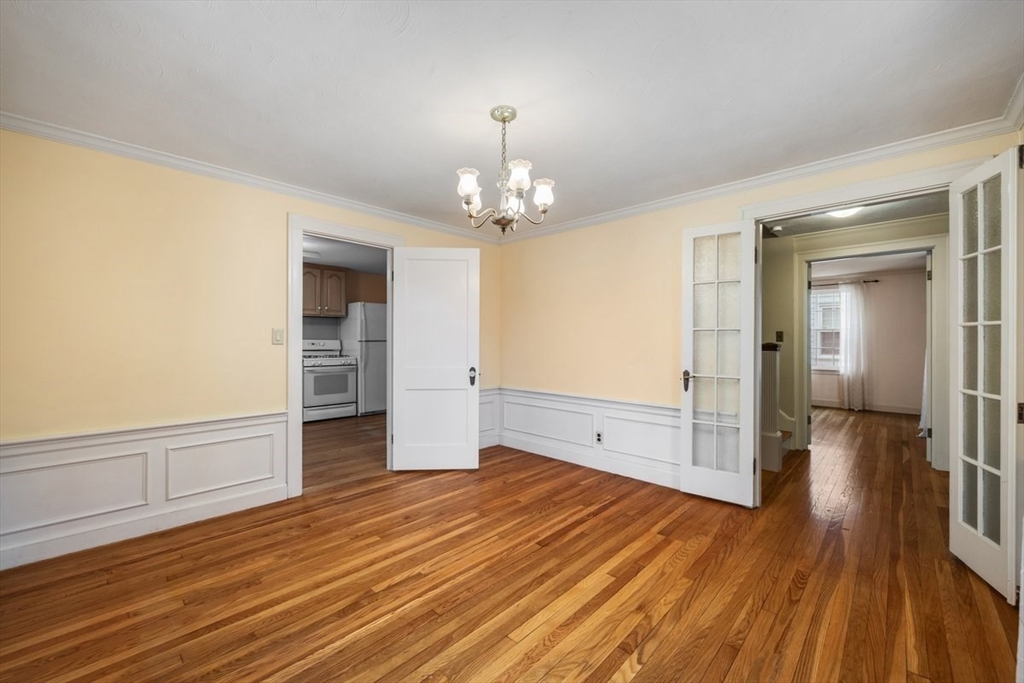 18 Bates Road Arlington, MA 02474 - Photo 12 of 42 wooden floor in an empty room with a window