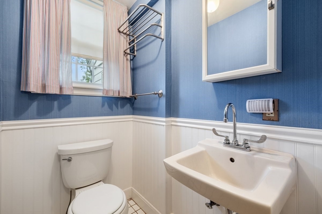 18 Bates Road Arlington, MA 02474 - Photo 15 of 42 a bathroom with a toilet sink and mirror