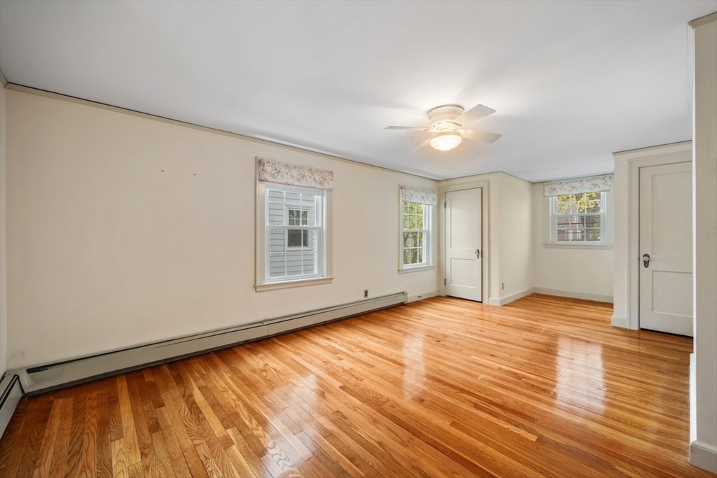 18 Bates Road Arlington, MA 02474 - Photo 19 of 42 a view of an empty room with window and wooden floor