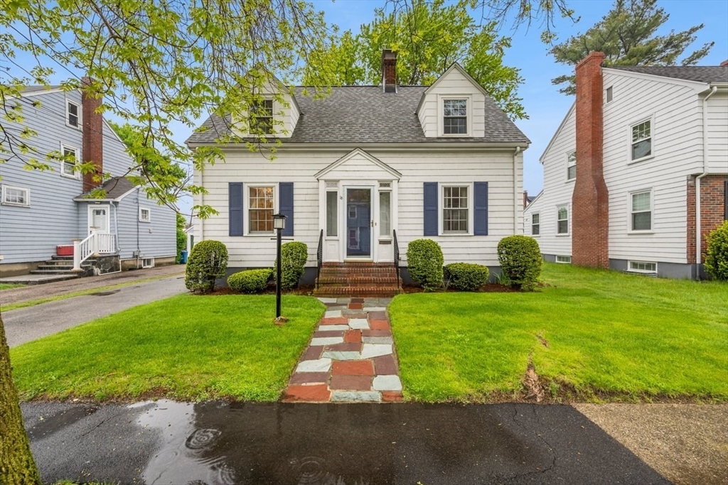18 Bates Road Arlington, MA 02474 - Photo 2 of 42 a front view of house with yard and green space