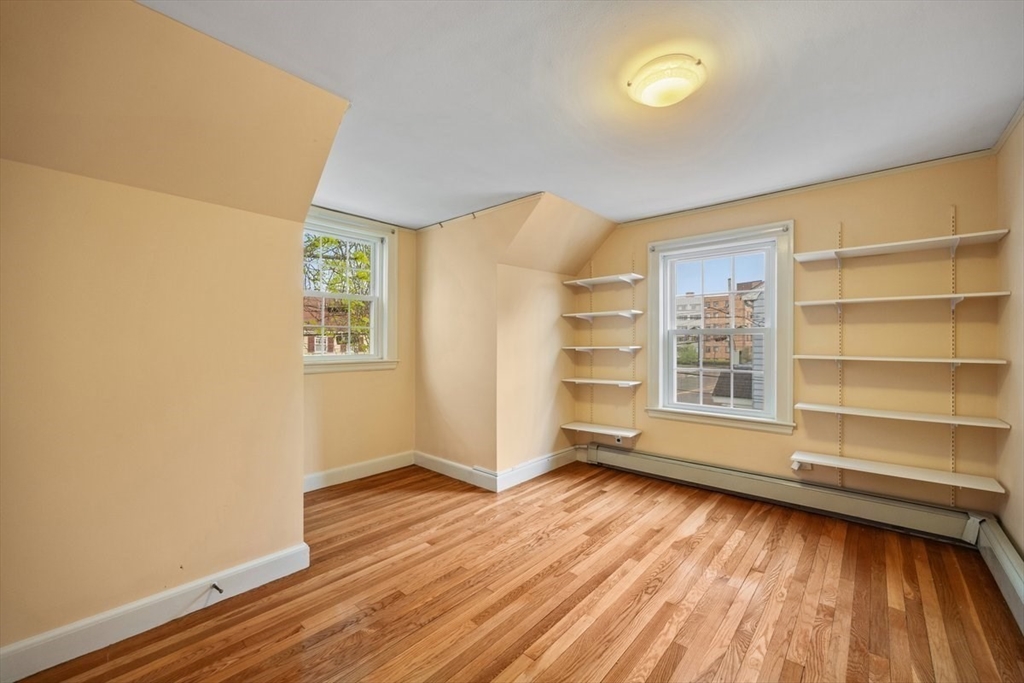 18 Bates Road Arlington, MA 02474 - Photo 21 of 42 an empty room with wooden floor and windows