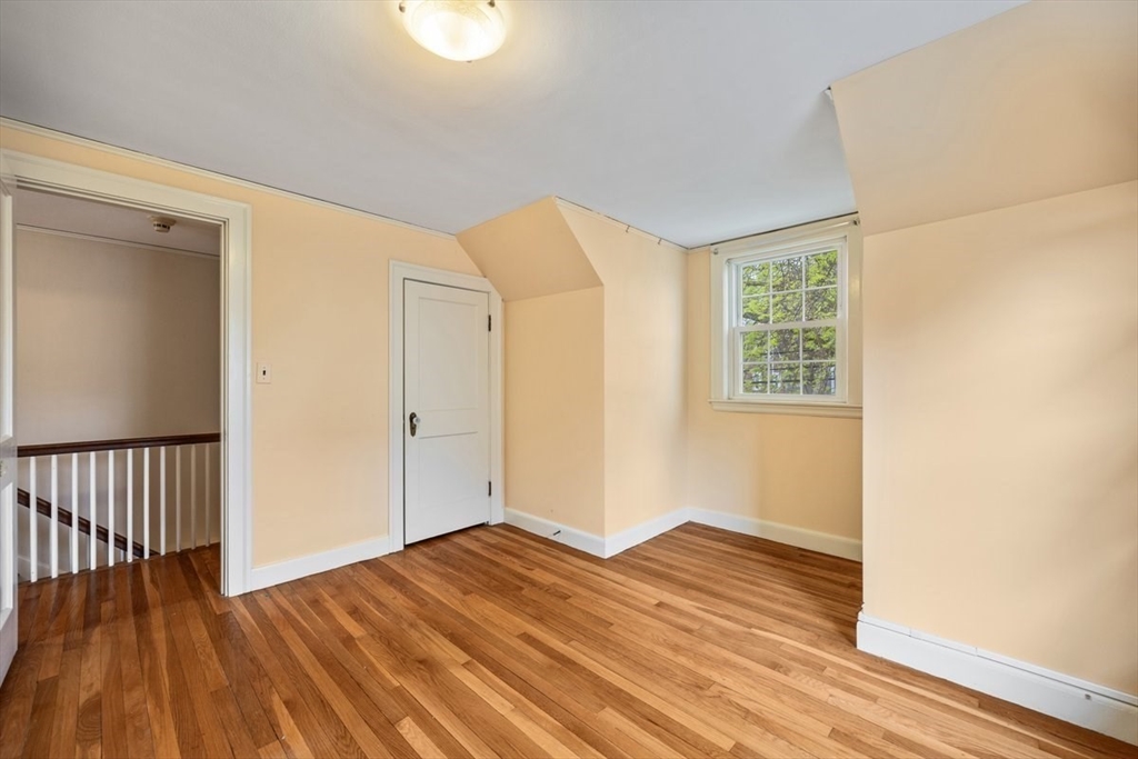 18 Bates Road Arlington, MA 02474 - Photo 22 of 42 a view of empty room with wooden floor and fan