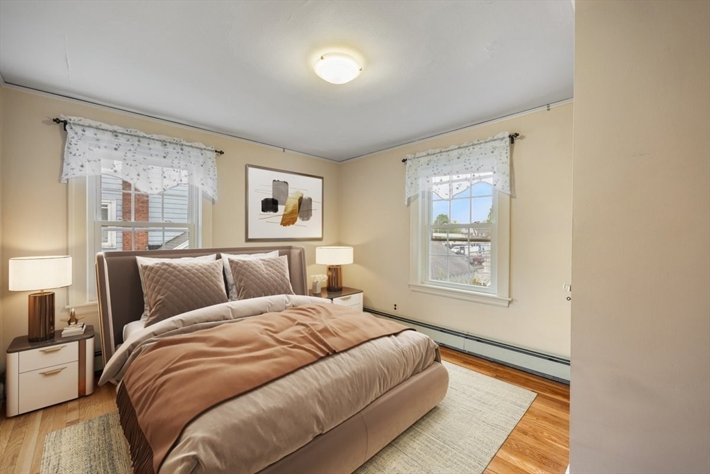 18 Bates Road Arlington, MA 02474 - Photo 23 of 42 a bed room with a bed and a window