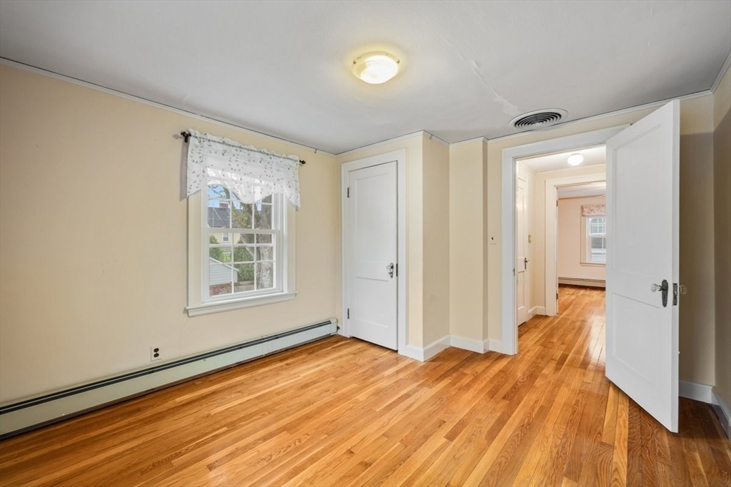 18 Bates Road Arlington, MA 02474 - Photo 25 of 42 a view of a room with wooden floor and bathroom