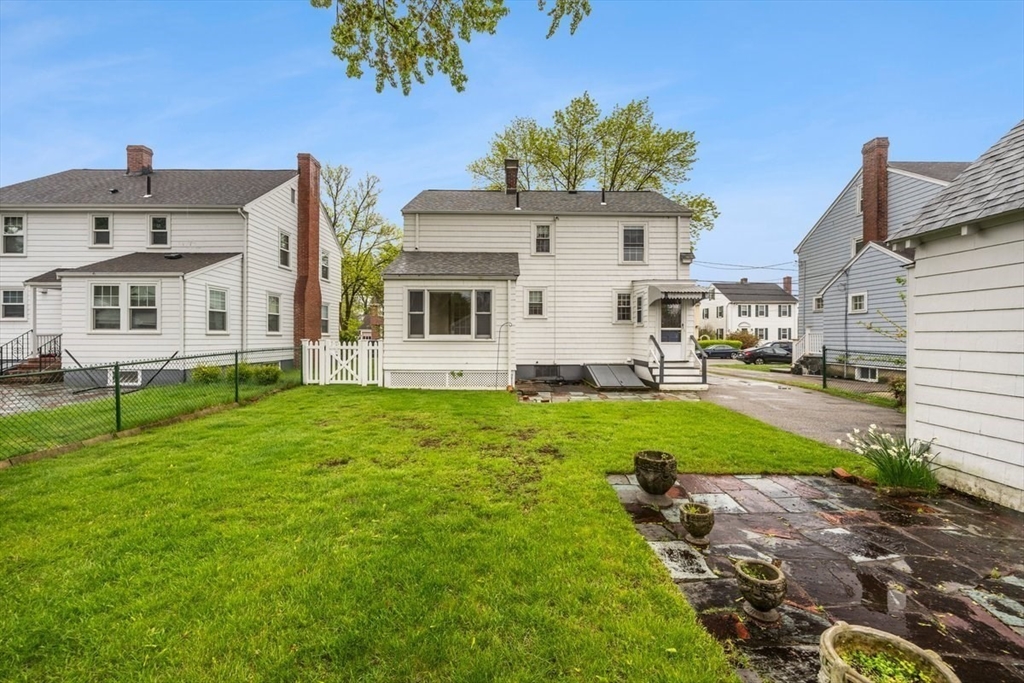 18 Bates Road Arlington, MA 02474 - Photo 34 of 42 a front view of a house with garden
