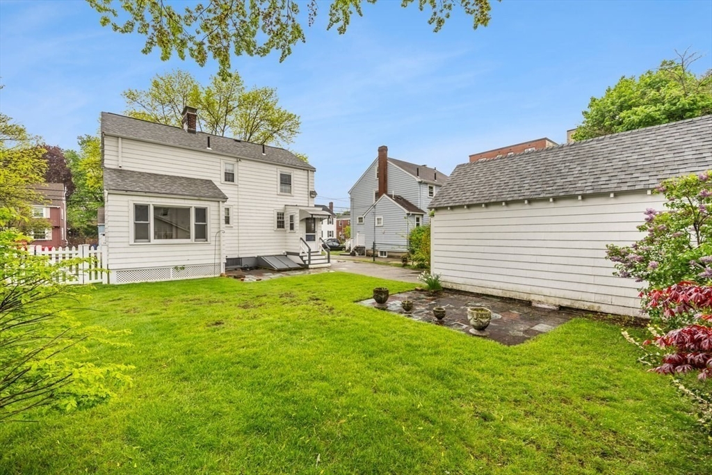 18 Bates Road Arlington, MA 02474 - Photo 36 of 42 a view of a house with a backyard