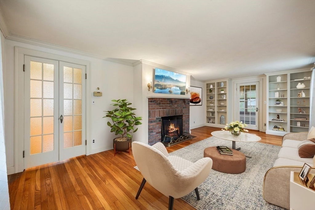 18 Bates Road Arlington, MA 02474 - Photo 6 of 42 a living room with furniture and a fireplace
