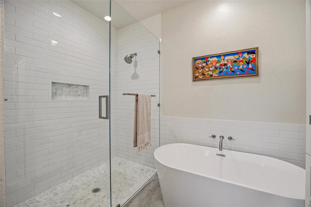 1525 North Bosley Road Santo, TX 76472 - Photo 18 of 40 a white bath tub sitting next to a shower