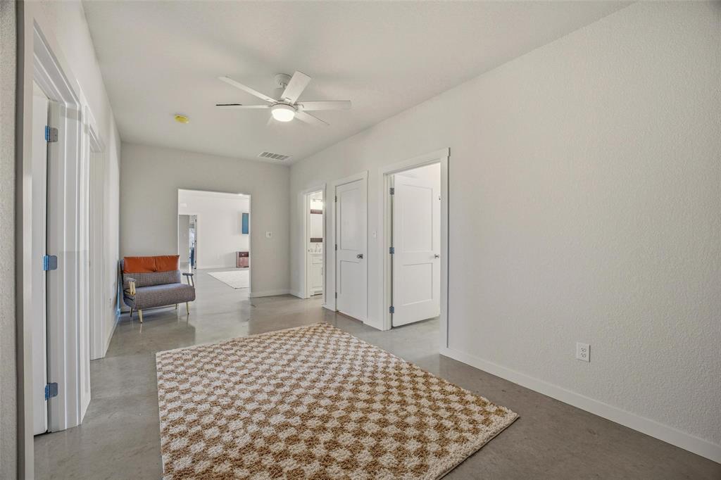1525 North Bosley Road Santo, TX 76472 - Photo 22 of 40 a bedroom with a bed and a view of bathroom