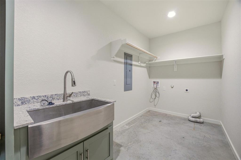 1525 North Bosley Road Santo, TX 76472 - Photo 28 of 40 a bathroom with a sink and vanity