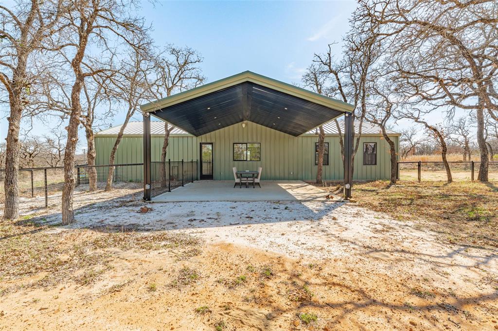 1525 North Bosley Road Santo, TX 76472 - Photo 30 of 40 a front view of a house with a yard