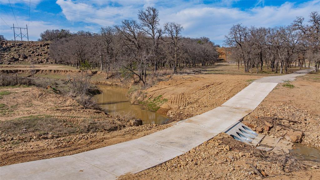 1525 North Bosley Road Santo, TX 76472 - Photo 40 of 40 a view of yard covered with snow in the background