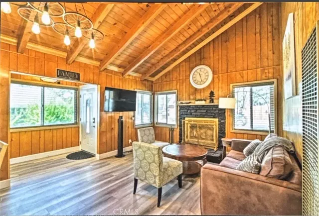 a living room with furniture a large window with outer view