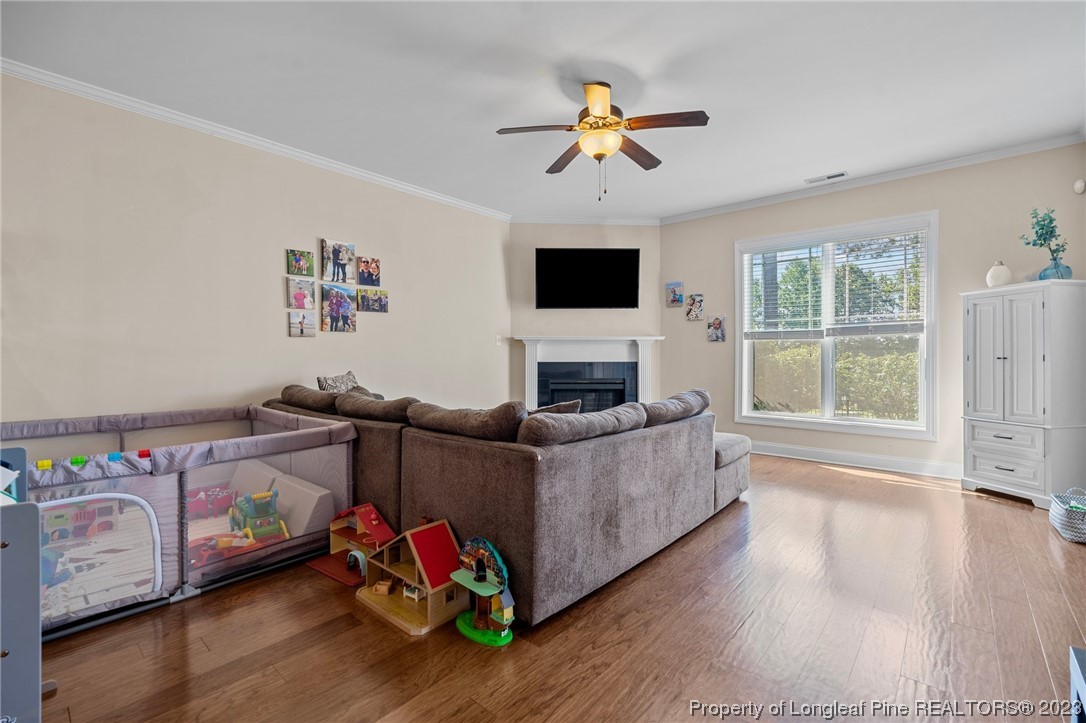 1365 Micahs Way North Spring Lake, NC 28390 - Photo 14 of 36 a living room with furniture and a flat screen tv