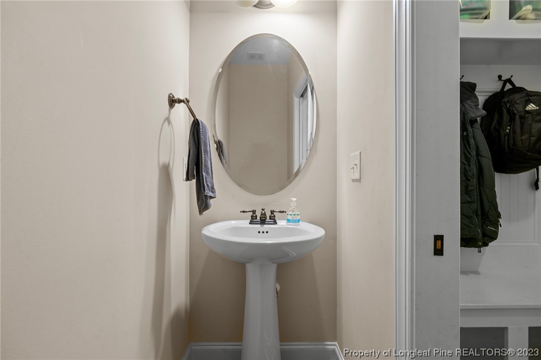 1365 Micahs Way North Spring Lake, NC 28390 - Photo 19 of 36 a bathroom with a sink and a mirror