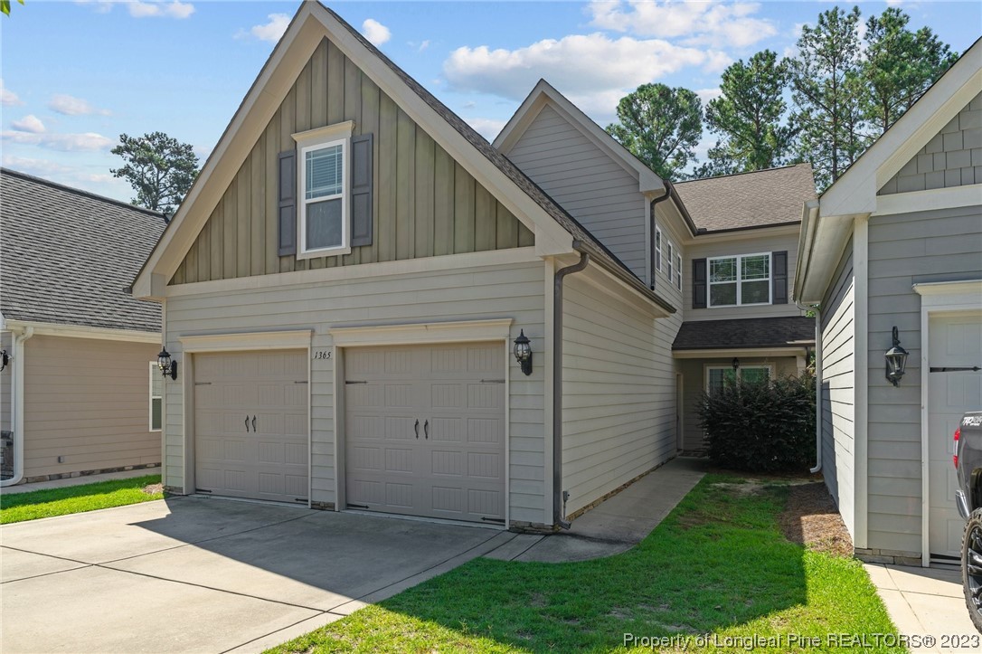 1365 Micahs Way North Spring Lake, NC 28390 - Photo 2 of 36 a view of a house with a yard