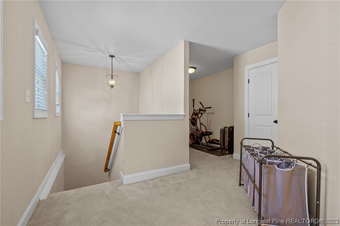 1365 Micahs Way North Spring Lake, NC 28390 - Photo 29 of 36 a view of walk in closet with clothes and shoes
