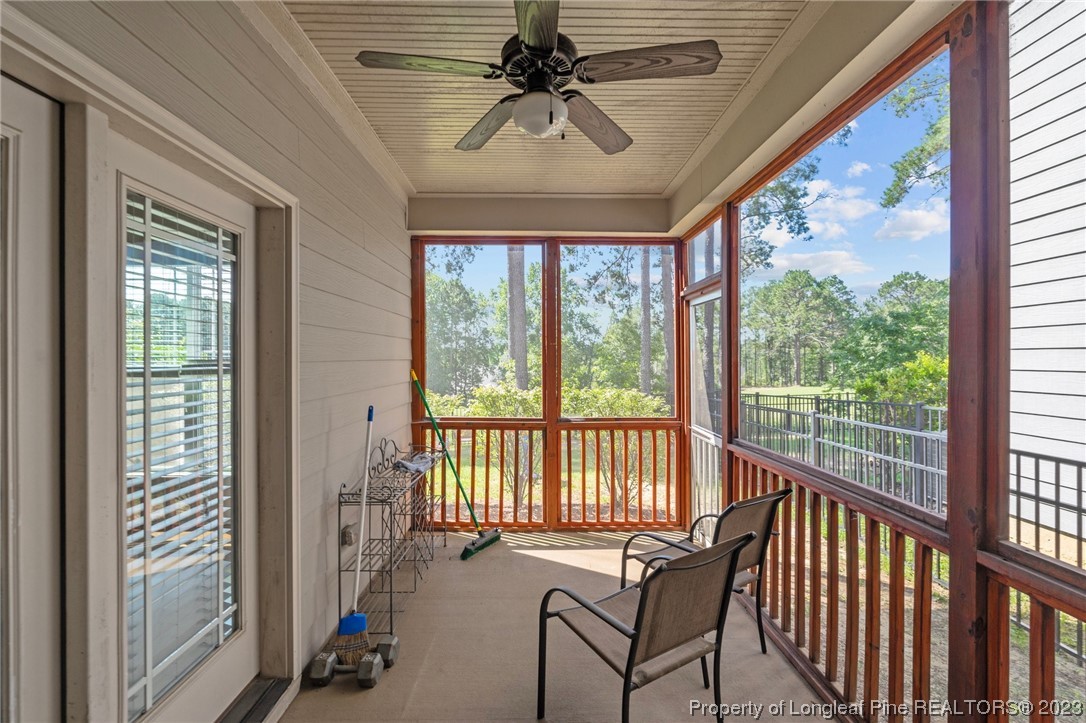 1365 Micahs Way North Spring Lake, NC 28390 - Photo 32 of 36 a view of a porch with furniture and a ceiling fan