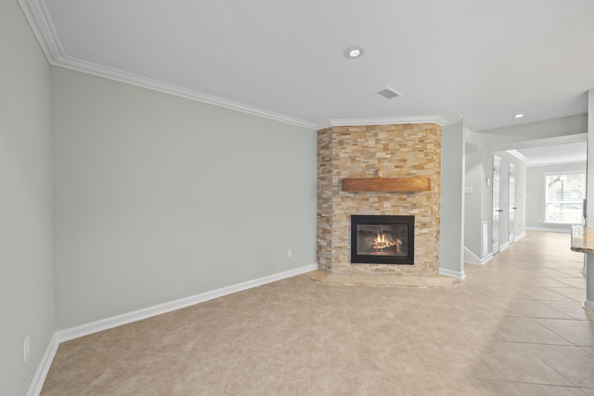 5801 Lumberdale Road, Unit 132 Houston, TX 77092 - Photo 9 of 33 Dining area with floor-to-ceiling stone fireplace