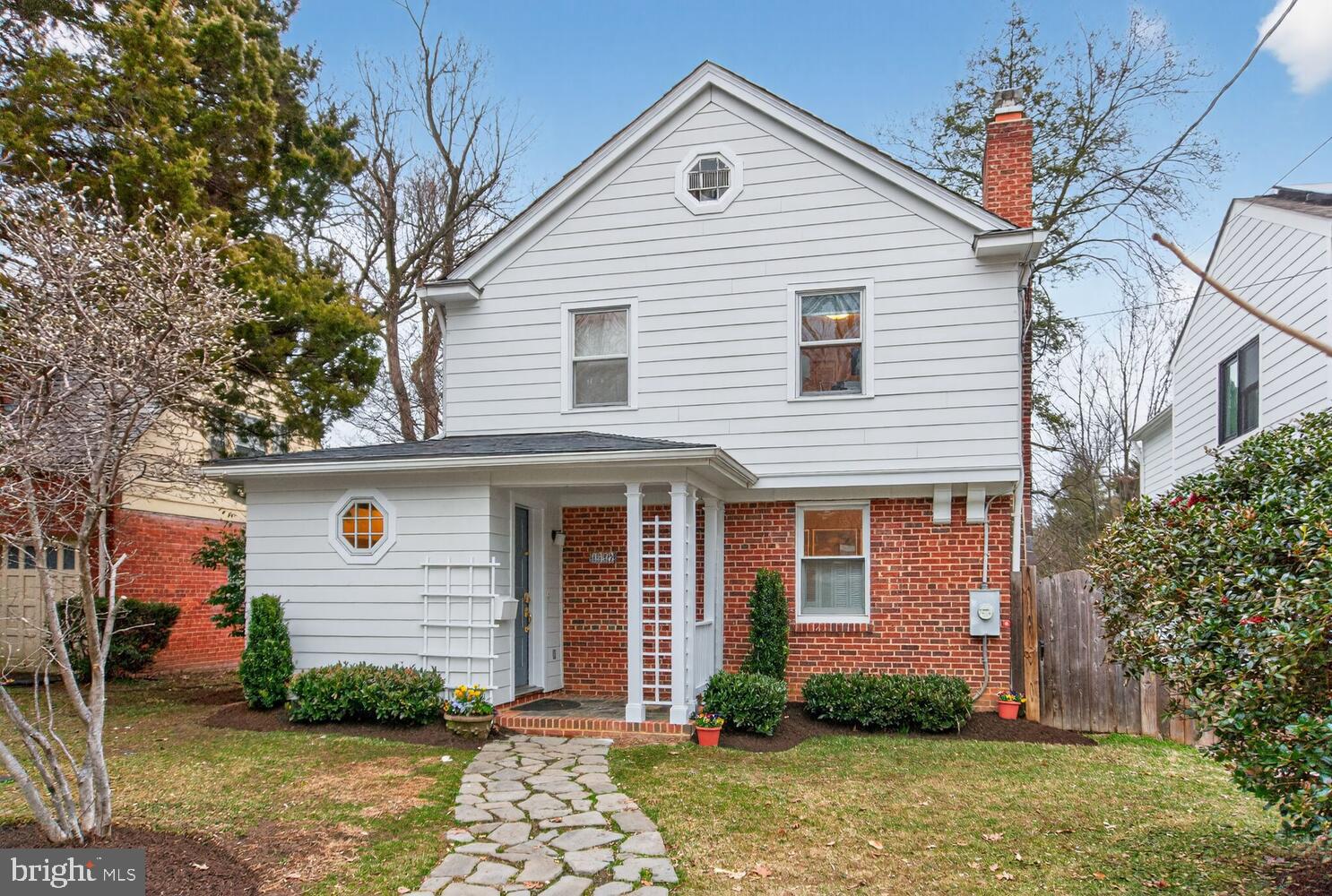 4529 38th Street Northwest Washington, DC 20016 - Photo 1 of 32 a front view of a house with garden