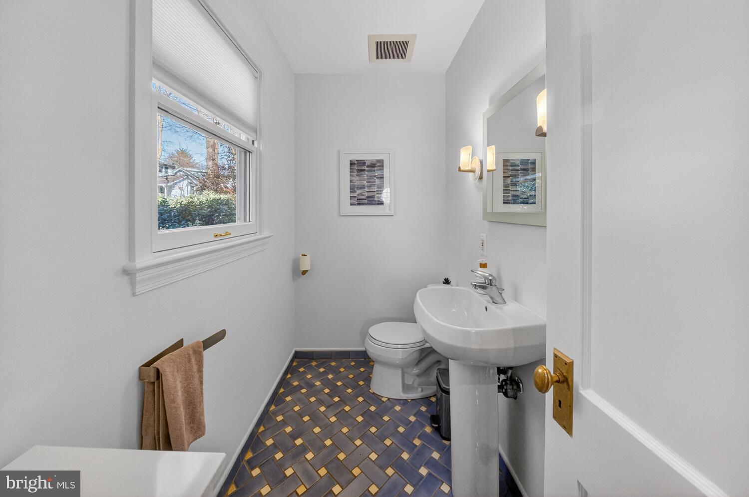 4529 38th Street Northwest Washington, DC 20016 - Photo 12 of 32 a bathroom with a sink toilet and a mirror
