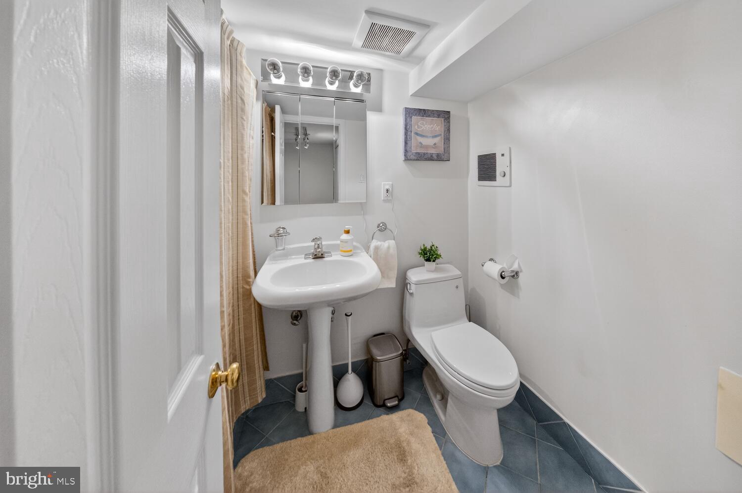 4529 38th Street Northwest Washington, DC 20016 - Photo 24 of 32 a white toilet sitting next to a bathroom sink