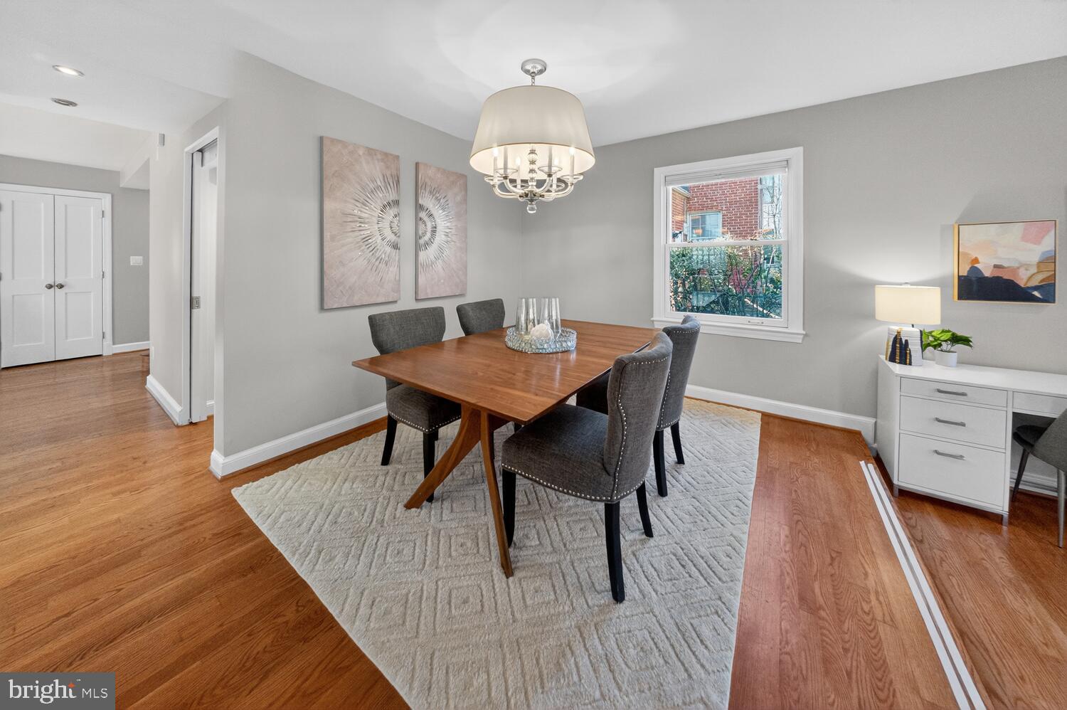 4529 38th Street Northwest Washington, DC 20016 - Photo 5 of 32 a dining room with furniture a chandelier and wooden floor